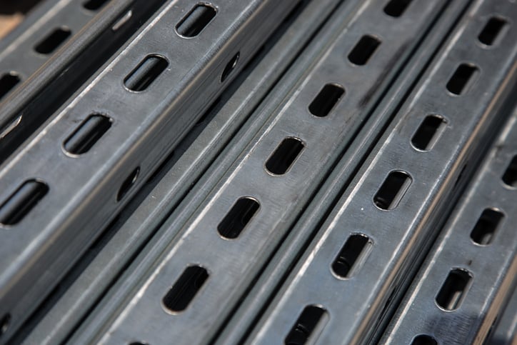 Close-up of corrosion-resistant metal strut channels used in electrical infrastructure and industrial support systems.